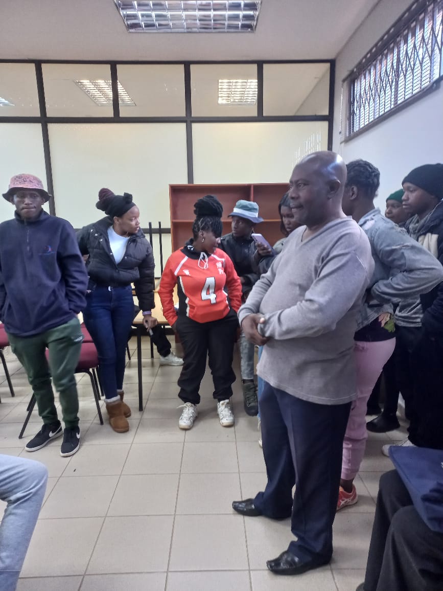 President speaking with young members